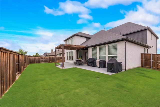 3900 Brazoria Dr, Prosper, TX 75078 - back of property with a fenced backyard, a shingled roof, a patio area, and brick siding