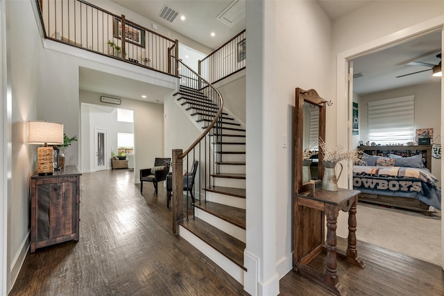 3900 Brazoria Dr, Prosper, TX 75078 - staircase featuring wood finished floors, a towering ceiling, and recessed lighting