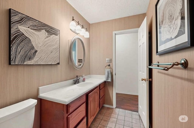 2705 Willowood Dr, Grapevine, TX 76051 - half bathroom with vanity, tile patterned floors, and a textured ceiling