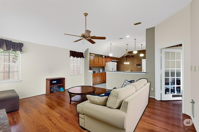 2705 Willowood Dr, Grapevine, TX 76051 - living area with vaulted ceiling, wood finished floors, plenty of natural light, and ceiling fan