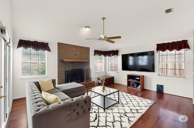 2705 Willowood Dr, Grapevine, TX 76051 - living area featuring a ceiling fan, wood finished floors, and a fireplace