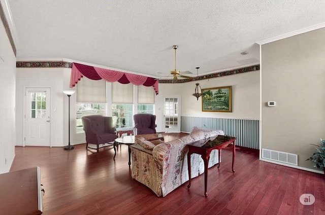 2705 Willowood Dr, Grapevine, TX 76051 - living room featuring a ceiling fan, ornamental molding, wood finished floors, and a textured ceiling