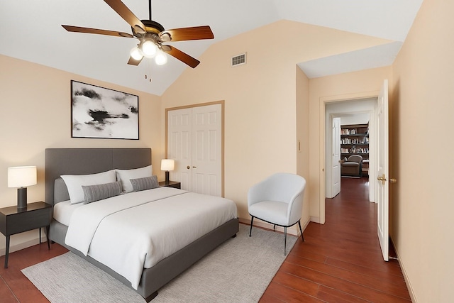 2705 Willowood Dr, Grapevine, TX 76051 - bedroom featuring dark wood finished floors, lofted ceiling, a closet, and a ceiling fan