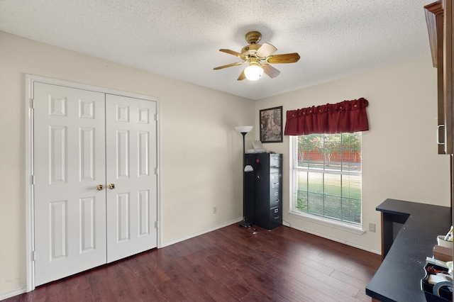 2705 Willowood Dr, Grapevine, TX 76051 - unfurnished bedroom with dark wood-style flooring, a closet, a textured ceiling, and a ceiling fan