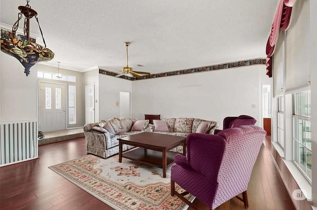 2705 Willowood Dr, Grapevine, TX 76051 - living room featuring wood finished floors, crown molding, and a textured ceiling
