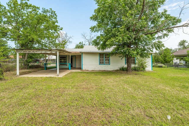280 W Walnut St, Stephenville, TX 76401 - back of house featuring a carport and a patio area