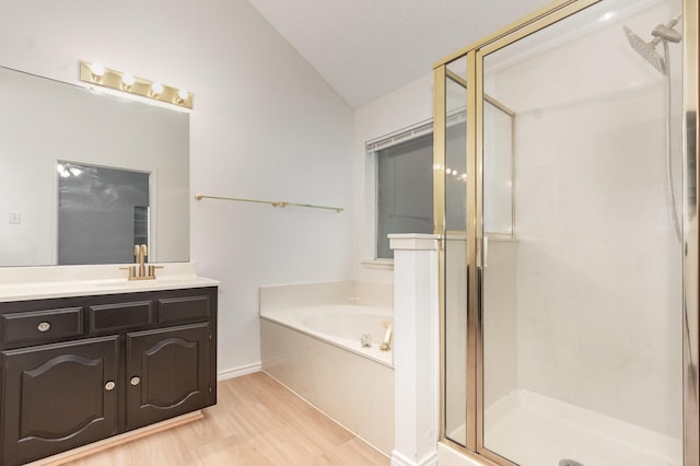 2515 High Pointe Blvd, Mckinney, TX 75071 - full bath featuring lofted ceiling, a shower stall, vanity, a bath, and wood finished floors