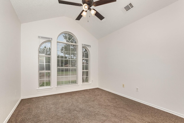 2515 High Pointe Blvd, Mckinney, TX 75071 - empty room with a ceiling fan, dark carpet, and vaulted ceiling