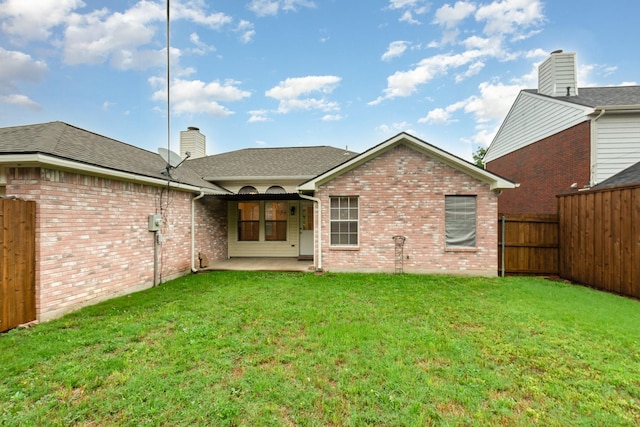 2515 High Pointe Blvd, Mckinney, TX 75071 - back of house with brick siding, a patio, a fenced backyard, a chimney, and roof with shingles
