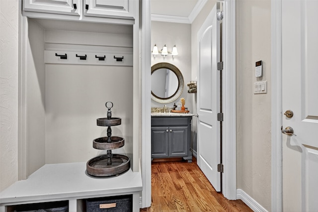 2427 Remuda Dr, Sherman, TX 75092 - mudroom featuring crown molding and wood finished floors