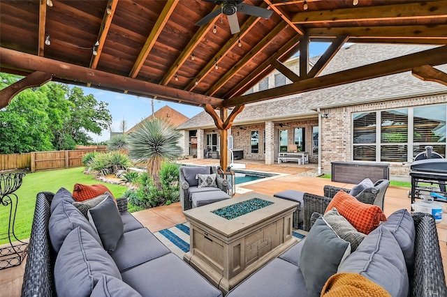 2427 Remuda Dr, Sherman, TX 75092 - fenced backyard with an outdoor living space with a fire pit, a patio, and ceiling fan