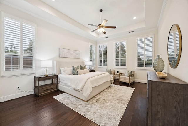 6873 Martel Pl, Frisco, TX 75035 - bedroom with multiple windows, a raised ceiling, dark wood finished floors, recessed lighting, and ceiling fan