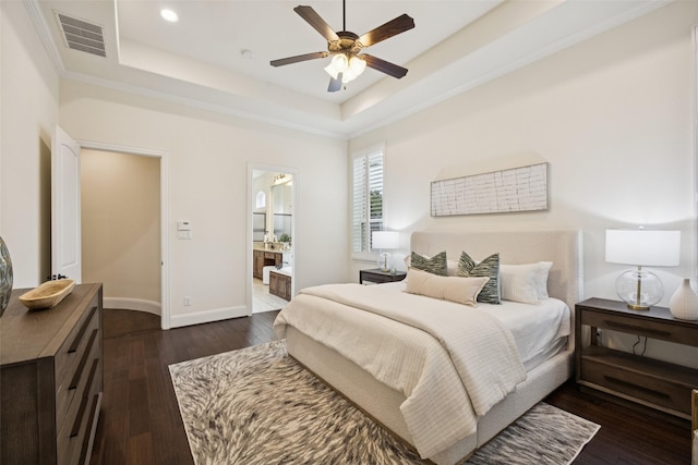 6873 Martel Pl, Frisco, TX 75035 - bedroom featuring a raised ceiling, dark wood-type flooring, recessed lighting, ensuite bath, and ceiling fan