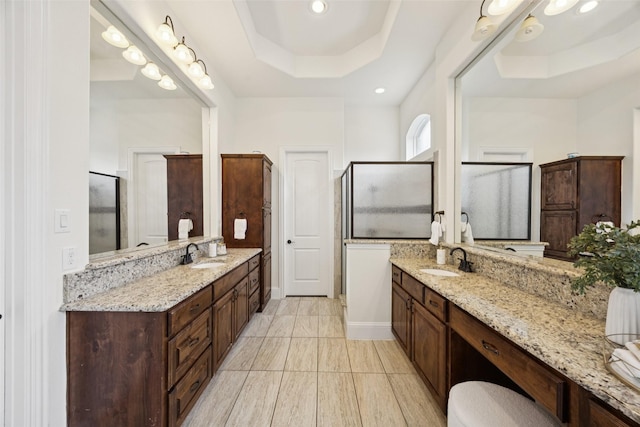6873 Martel Pl, Frisco, TX 75035 - full bathroom featuring a tray ceiling, vanity, a shower stall, and recessed lighting
