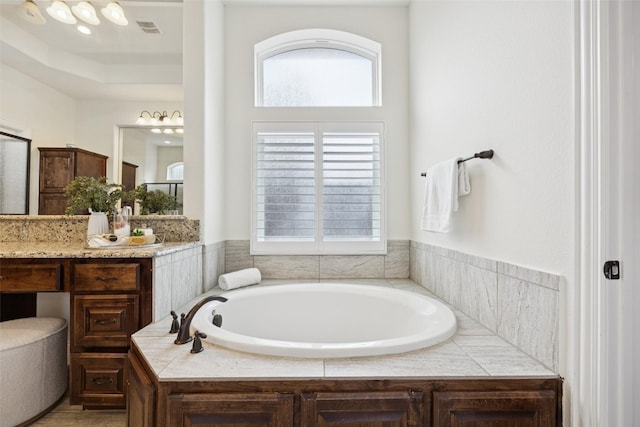6873 Martel Pl, Frisco, TX 75035 - bathroom with a garden tub and vanity