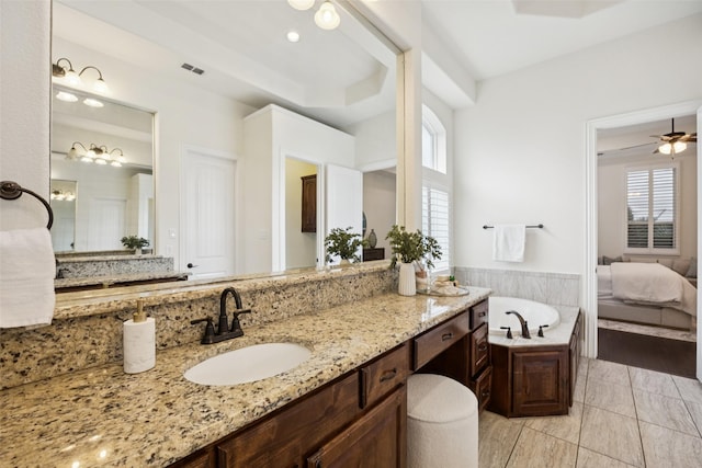 6873 Martel Pl, Frisco, TX 75035 - bathroom featuring a bath, vanity, connected bathroom, and ceiling fan