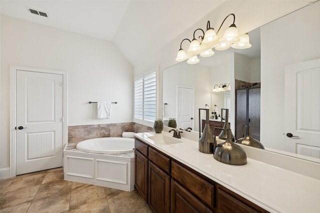 6873 Martel Pl, Frisco, TX 75035 - full bathroom with a shower stall, a garden tub, vanity, and lofted ceiling