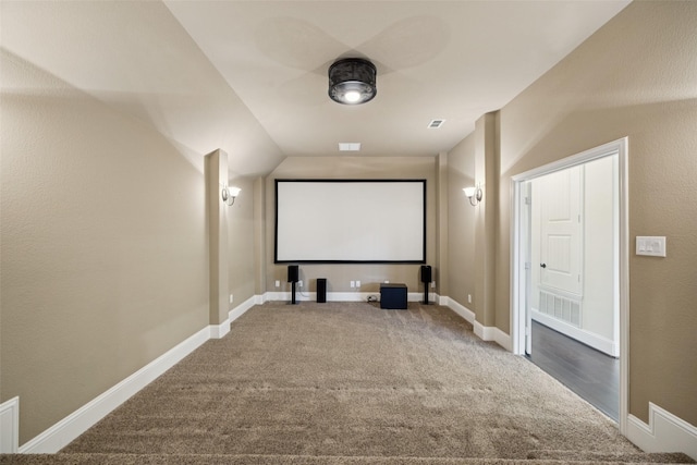 6873 Martel Pl, Frisco, TX 75035 - carpeted home theater with lofted ceiling and baseboards