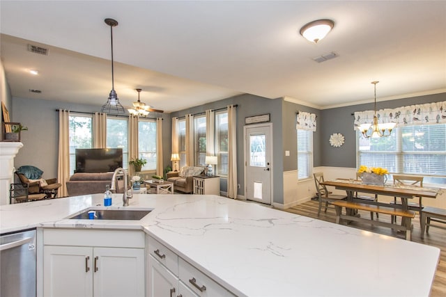 5216 Copper Creek Dr, Fort Worth, TX 76244 - kitchen with stainless steel dishwasher, open floor plan, wood finished floors, a chandelier, and decorative light fixtures