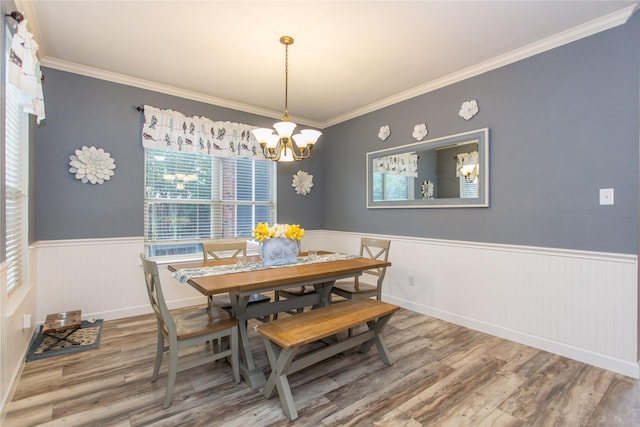 5216 Copper Creek Dr, Fort Worth, TX 76244 - dining space featuring a wainscoted wall, a chandelier, wood finished floors, and crown molding