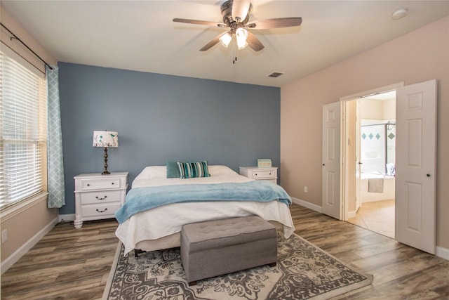 5216 Copper Creek Dr, Fort Worth, TX 76244 - bedroom with wood finished floors, ensuite bath, and ceiling fan