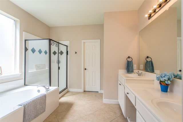 5216 Copper Creek Dr, Fort Worth, TX 76244 - bathroom with double vanity, a stall shower, a garden tub, and tile patterned floors