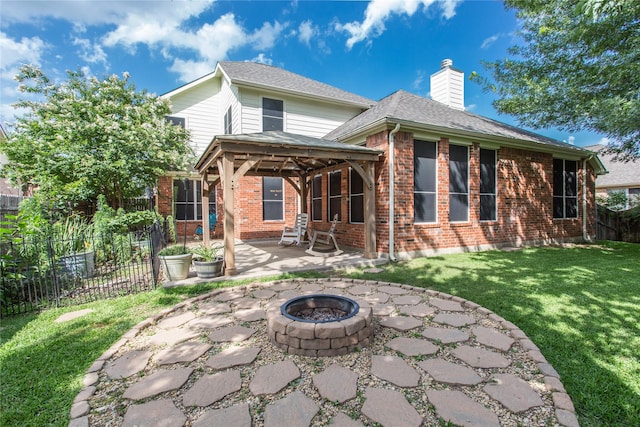5216 Copper Creek Dr, Fort Worth, TX 76244 - rear view of house with a patio, a gazebo, a fire pit, a chimney, and brick siding