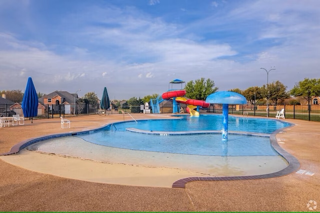 5216 Copper Creek Dr, Fort Worth, TX 76244 - community pool featuring a water slide, a patio, and a water play area