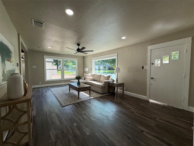 2849 Spruce Park Dr, Richland Hills, TX 76118 - living area featuring dark wood-style flooring, a ceiling fan, plenty of natural light, a textured ceiling, and recessed lighting