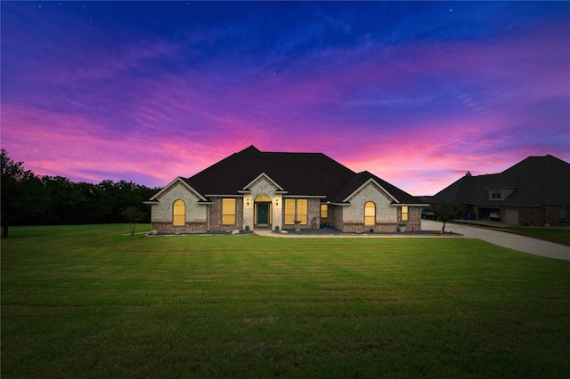 3217 S Bay Breeze Ln, Fort Worth, TX 76179 - french country style house featuring a front lawn, brick siding, and stone siding