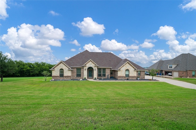 3217 S Bay Breeze Ln, Fort Worth, TX 76179 - french country style house with a front yard and brick siding