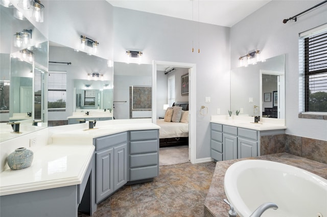 3217 S Bay Breeze Ln, Fort Worth, TX 76179 - ensuite bathroom featuring two vanities and a bath