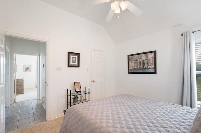 3217 S Bay Breeze Ln, Fort Worth, TX 76179 - carpeted bedroom with lofted ceiling, ceiling fan, and tile patterned flooring
