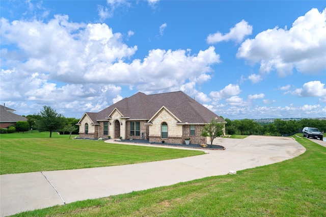 3217 S Bay Breeze Ln, Fort Worth, TX 76179 - french country home with a front yard and brick siding