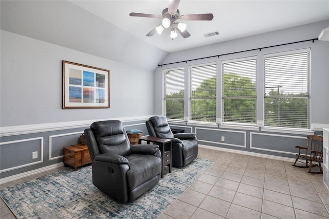 3217 S Bay Breeze Ln, Fort Worth, TX 76179 - sitting room with light tile patterned floors, lofted ceiling, a ceiling fan, and a wainscoted wall