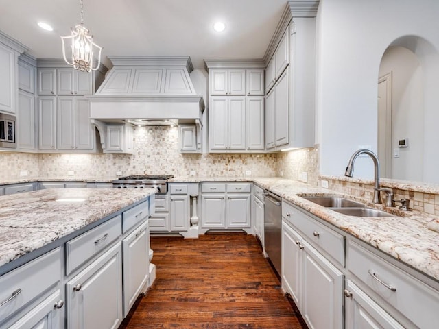 2911 Blackthorn Dr, Prosper, TX 75078 - kitchen featuring custom exhaust hood, appliances with stainless steel finishes, a chandelier, dark wood-style floors, and backsplash