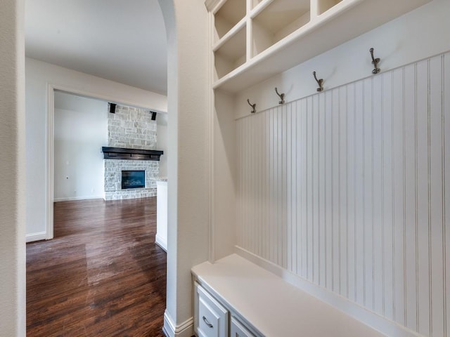 2911 Blackthorn Dr, Prosper, TX 75078 - mudroom with dark wood-style flooring and a fireplace