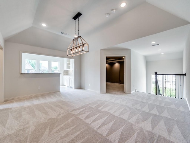 2911 Blackthorn Dr, Prosper, TX 75078 - spare room with vaulted ceiling, a chandelier, light colored carpet, and recessed lighting
