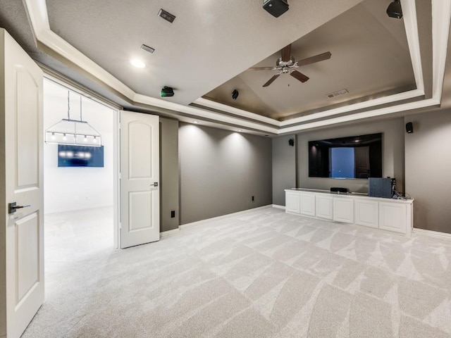 2911 Blackthorn Dr, Prosper, TX 75078 - cinema room with a tray ceiling, a ceiling fan, and light colored carpet