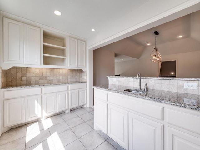 2911 Blackthorn Dr, Prosper, TX 75078 - kitchen featuring decorative backsplash, light tile patterned flooring, open shelves, pendant lighting, and white cabinets