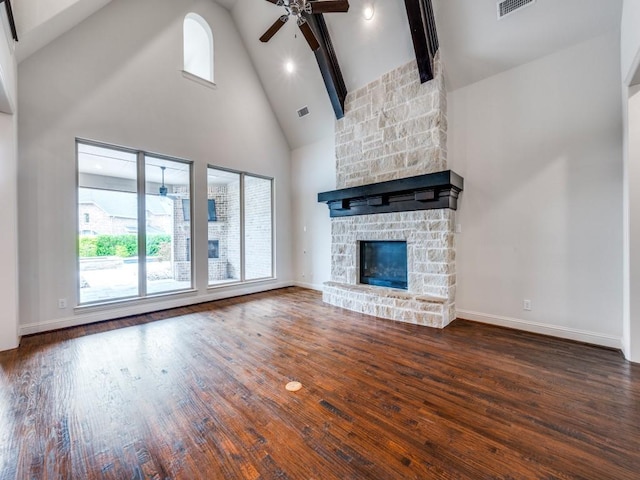 2911 Blackthorn Dr, Prosper, TX 75078 - unfurnished living room with high vaulted ceiling, ceiling fan, wood finished floors, a fireplace, and beamed ceiling