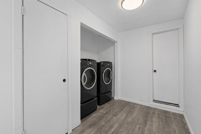 4236 Virginia Ln, Fort Worth, TX 76103 - laundry area with separate washer and dryer and wood finished floors