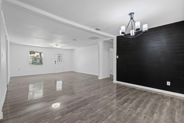 4236 Virginia Ln, Fort Worth, TX 76103 - unfurnished room featuring a chandelier and wood finished floors