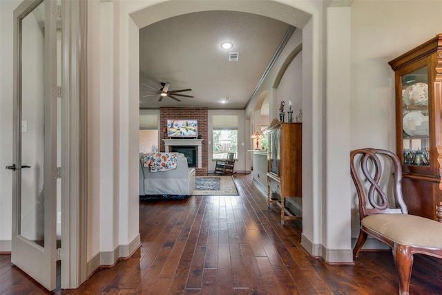 206 Hidden Meadow Cir, Midlothian, TX 76065 - corridor with arched walkways, dark wood finished floors, and ornamental molding
