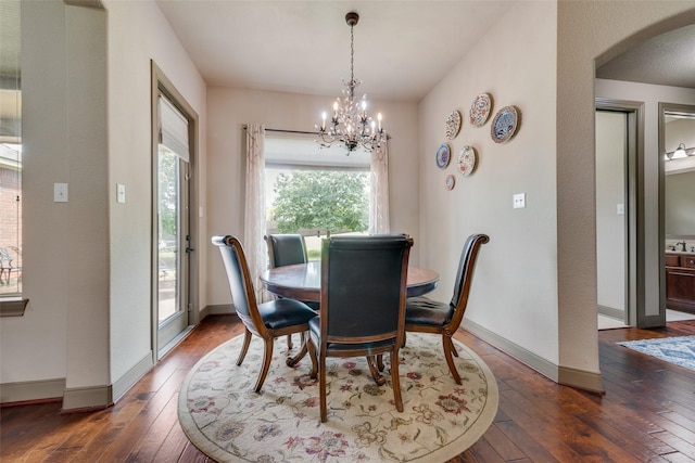 206 Hidden Meadow Cir, Midlothian, TX 76065 - dining area with hardwood / wood-style floors, arched walkways, and a chandelier