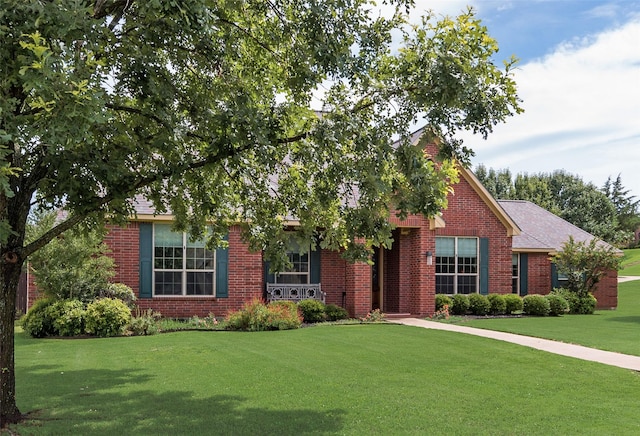 206 Hidden Meadow Cir, Midlothian, TX 76065 - obstructed view of property featuring a front yard and brick siding