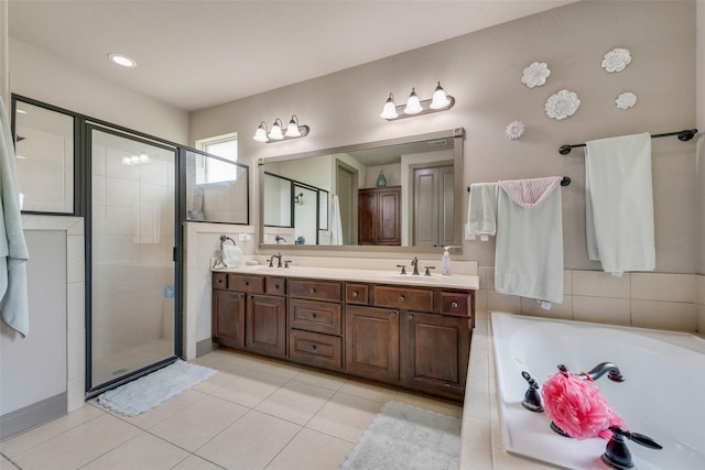 206 Hidden Meadow Cir, Midlothian, TX 76065 - bathroom featuring a shower stall, a garden tub, double vanity, and tile patterned floors