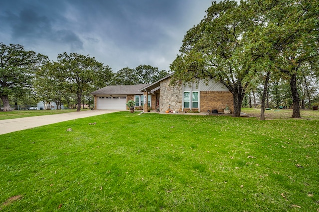 211 Willow Creek Ct, Mansfield, TX 76063 - view of front of home with concrete driveway, an attached garage, a front yard, brick siding, and stone siding