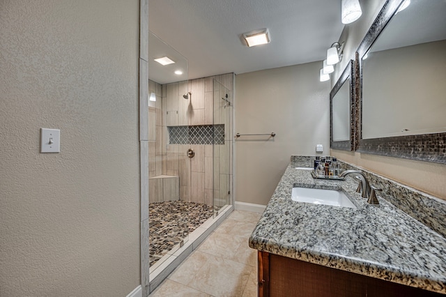 211 Willow Creek Ct, Mansfield, TX 76063 - bathroom featuring double vanity, a stall shower, and tile patterned flooring