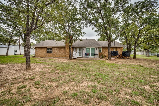 211 Willow Creek Ct, Mansfield, TX 76063 - rear view of property with a lawn, a patio, and brick siding